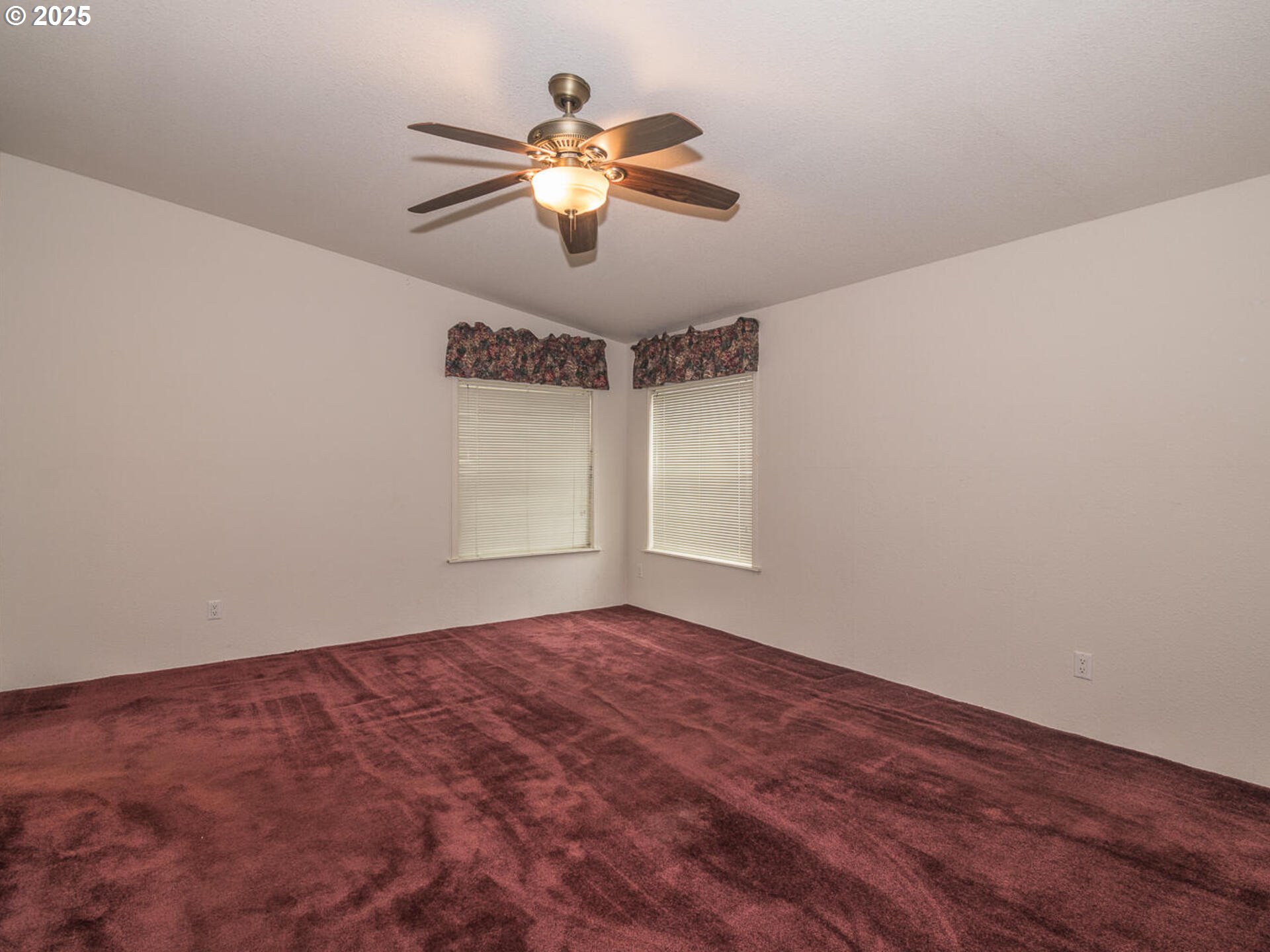 1949 Southeast Palmquist Road, Unit 91 Gresham, OR 97080 - Photo 26 of 40 a view of room with window and ceiling fan