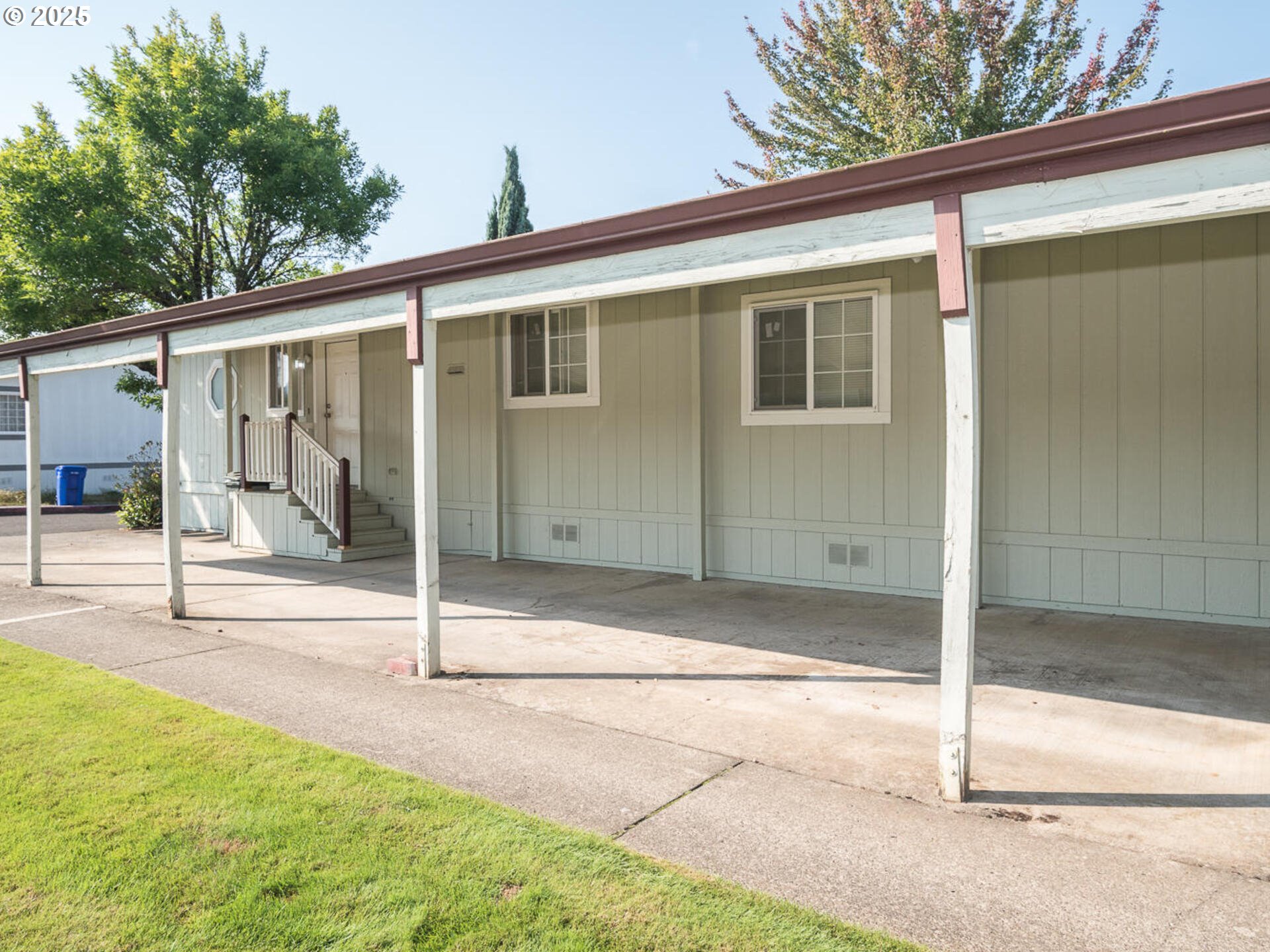 1949 Southeast Palmquist Road, Unit 91 Gresham, OR 97080 - Photo 7 of 40 a view of a house with a backyard and floor to ceiling window