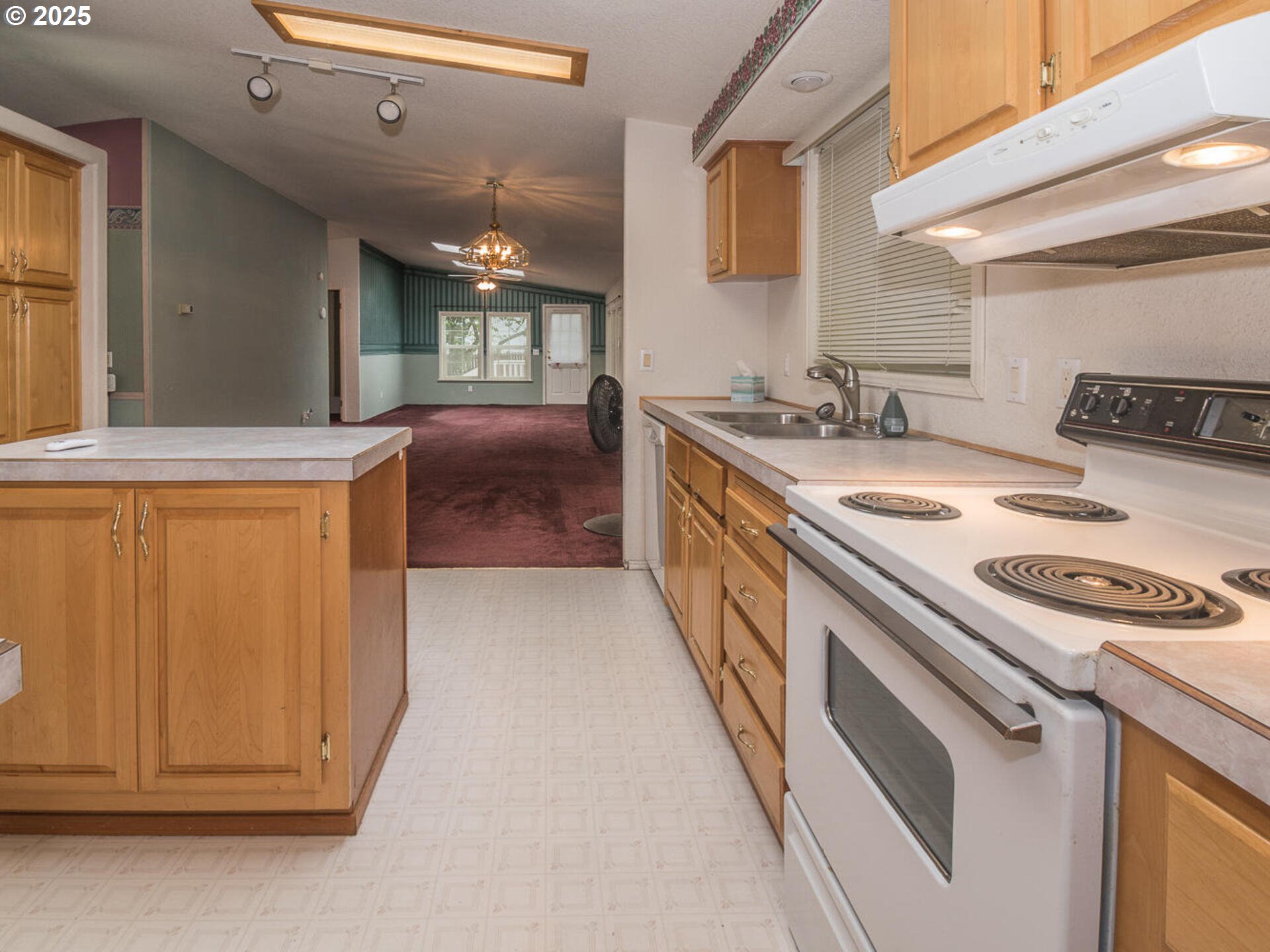 1949 Southeast Palmquist Road, Unit 91 Gresham, OR 97080 - Photo 8 of 40 a kitchen with a stove and a sink
