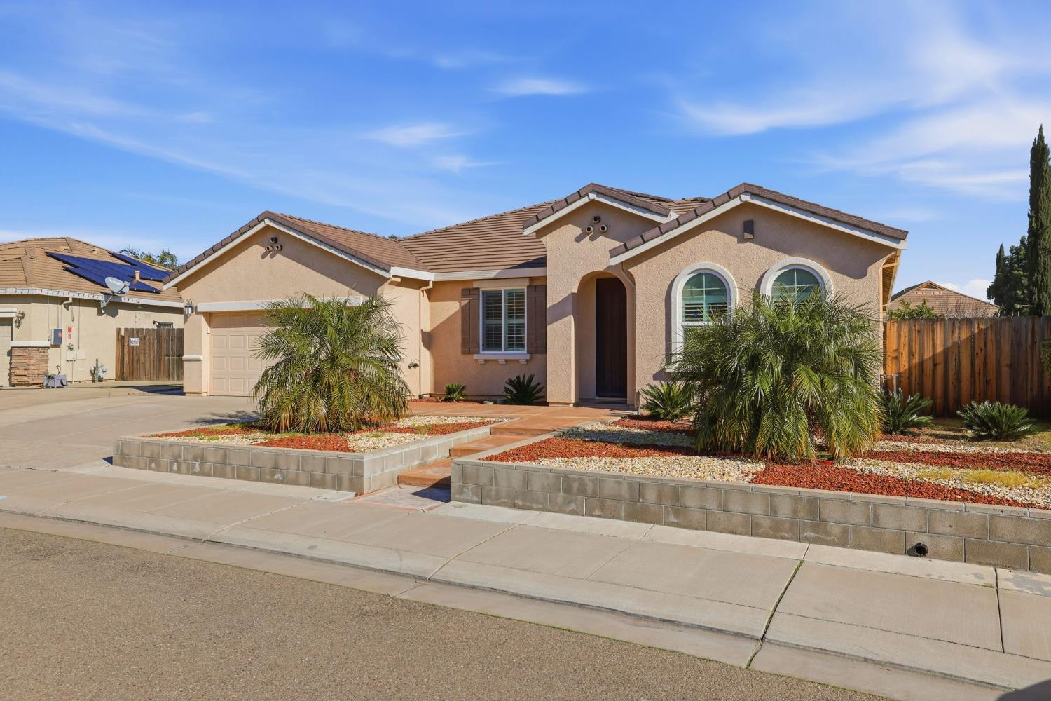 1730 Tasca Lane Manteca, CA 95337 - Photo 2 of 83 a front view of a house with a yard