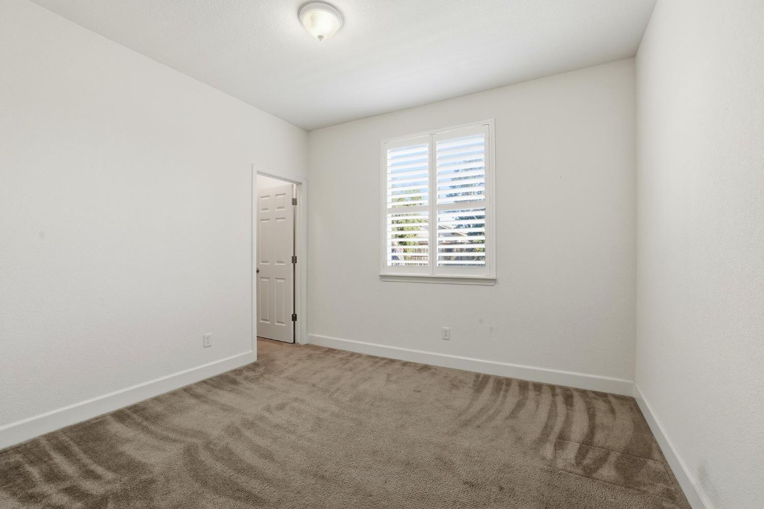 1730 Tasca Lane Manteca, CA 95337 - Photo 41 of 83 an empty room with a window
