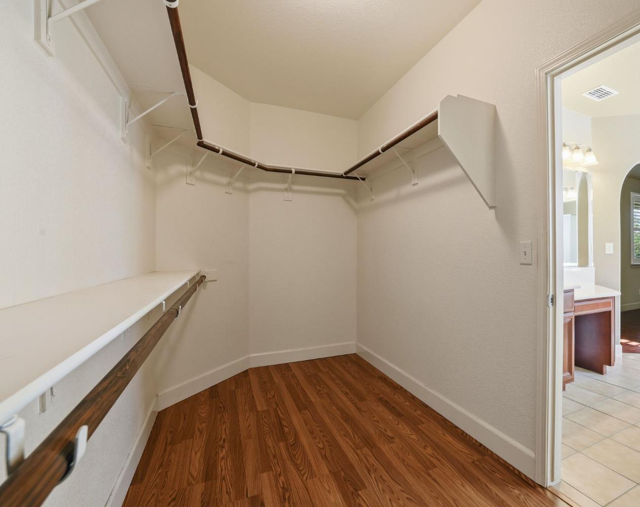 1730 Tasca Lane Manteca, CA 95337 - Photo 55 of 83 a view of a room with wooden floor and white walls