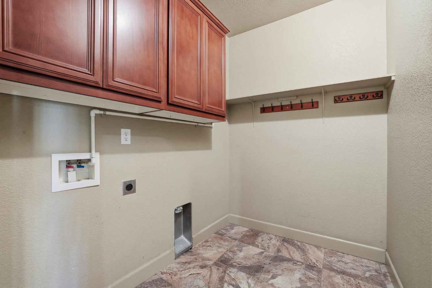 1730 Tasca Lane Manteca, CA 95337 - Photo 57 of 83 a view of a storage and utility room with washer and dryer