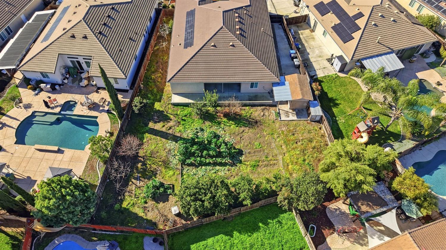 1730 Tasca Lane Manteca, CA 95337 - Photo 78 of 83 an aerial view of a house with garden space and street view
