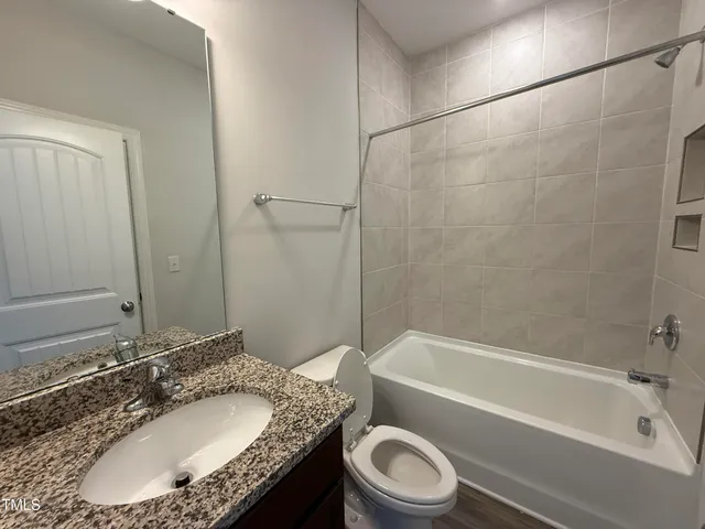 a view of a lake with a house in the background