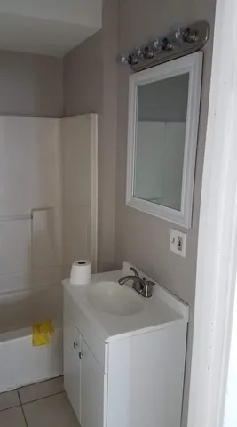 a kitchen with a sink stove and microwave