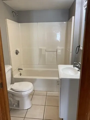 a kitchen with cabinets and window