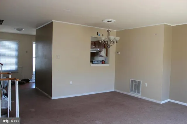 a view of a hallway with a chandelier