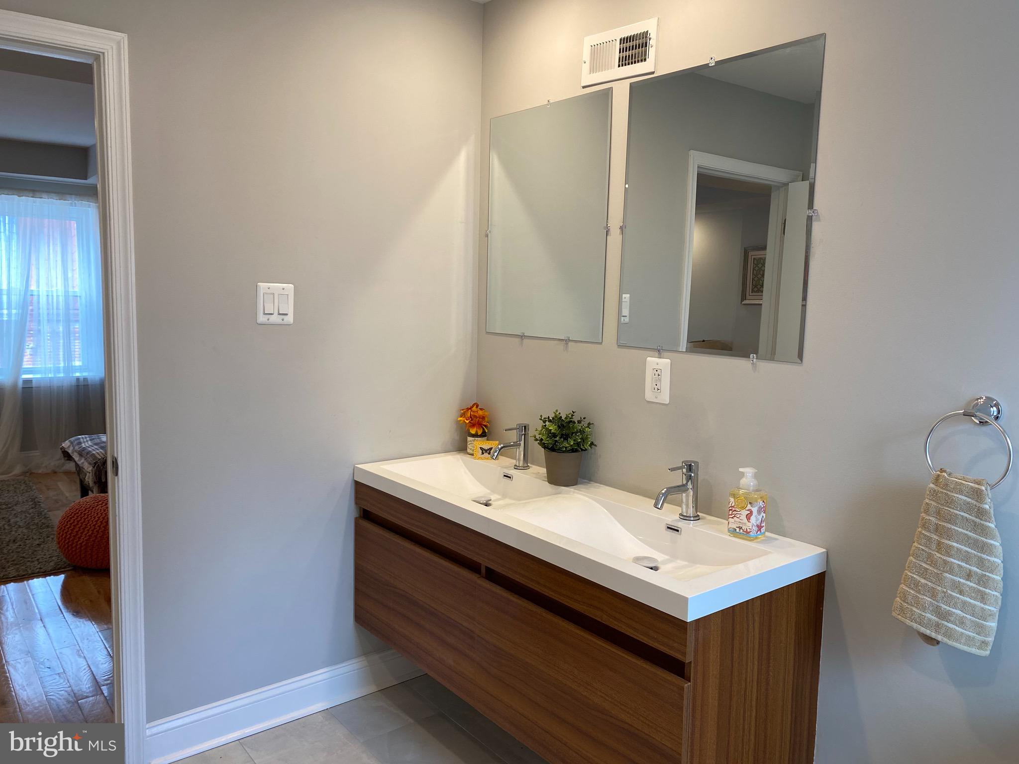 1432 Cambridge Street Philadelphia, PA 19130 - Photo 23 of 24 Mirror is getting changed to a large single LED