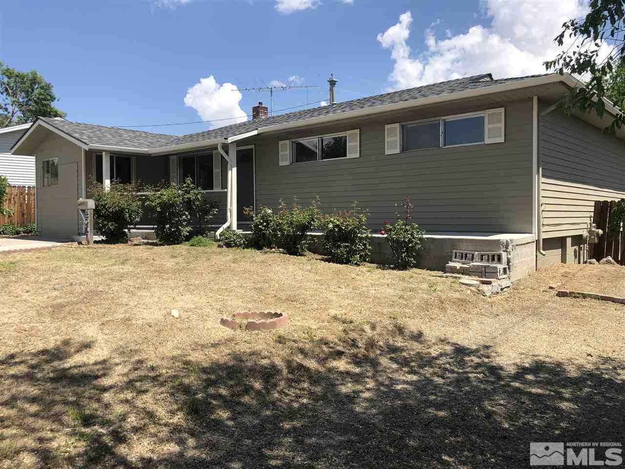 3201 Kings Row Reno, NV 89503 - Photo 3 of 17 a front view of a house with a yard