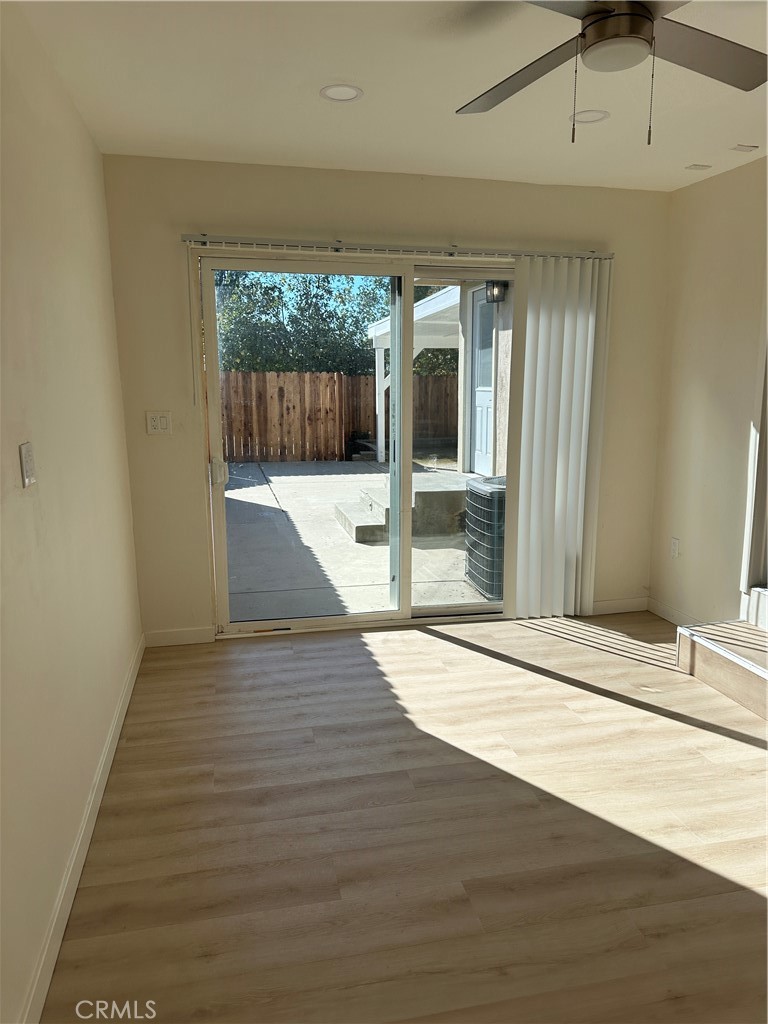 19140 Strathern Street Reseda, CA 91335 - Photo 12 of 33 a view of a hallway with wooden floor and a fireplace