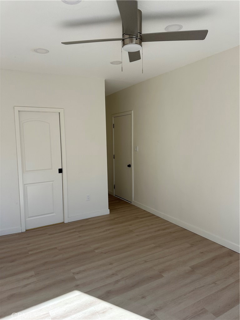 19140 Strathern Street Reseda, CA 91335 - Photo 14 of 33 a view of an empty room with wooden floor