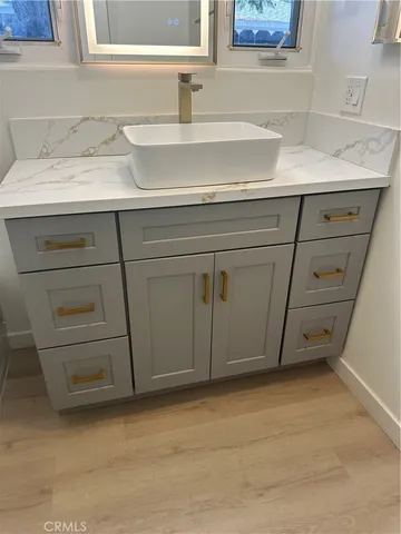 a white toilet sitting next to a shower