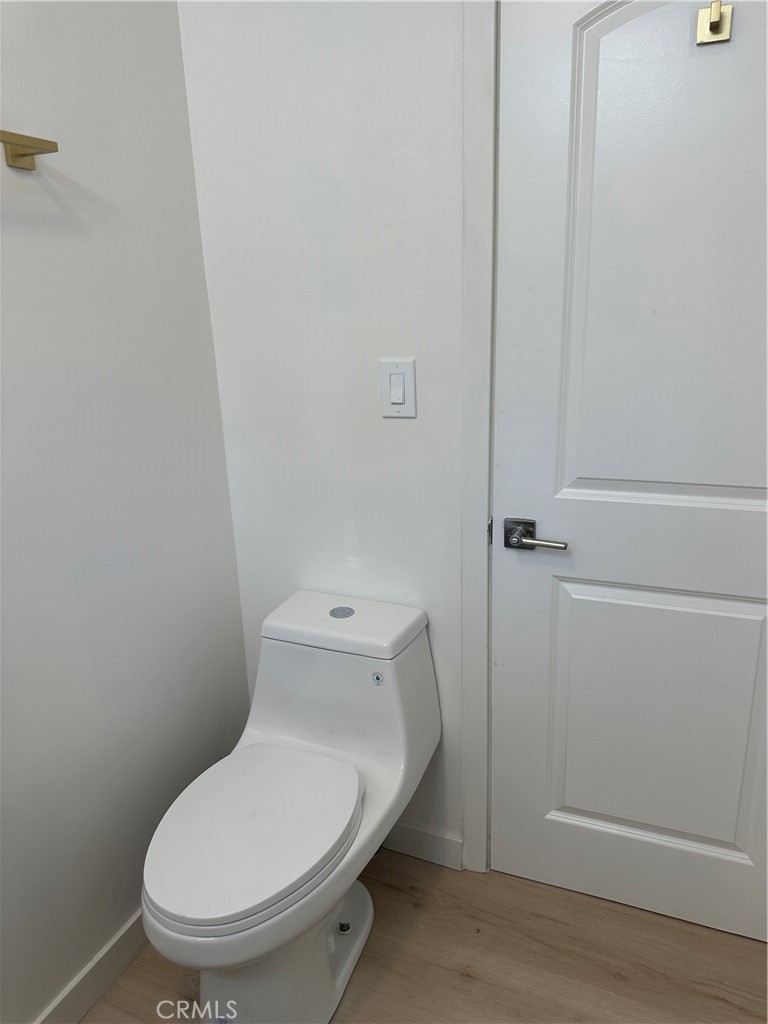 19140 Strathern Street Reseda, CA 91335 - Photo 18 of 33 a white toilet sitting next to a shower
