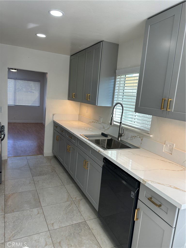 19140 Strathern Street Reseda, CA 91335 - Photo 21 of 33 a kitchen with a sink cabinets and window