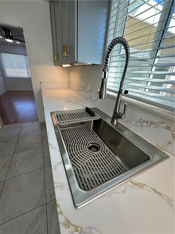 a white house with wooden fence