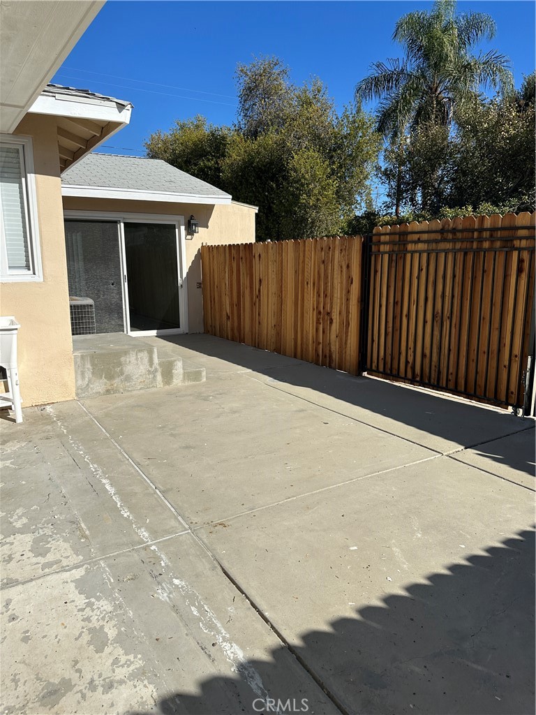 19140 Strathern Street Reseda, CA 91335 - Photo 25 of 33 a white house with wooden fence