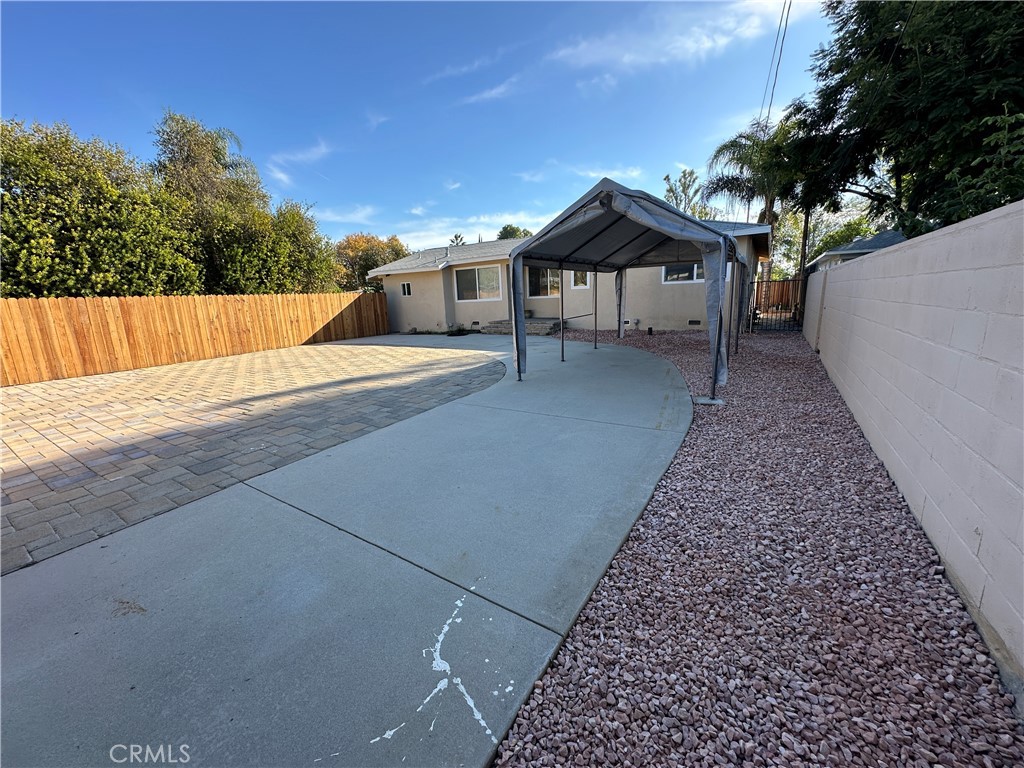 19140 Strathern Street Reseda, CA 91335 - Photo 30 of 33 a view of house with backyard and trees
