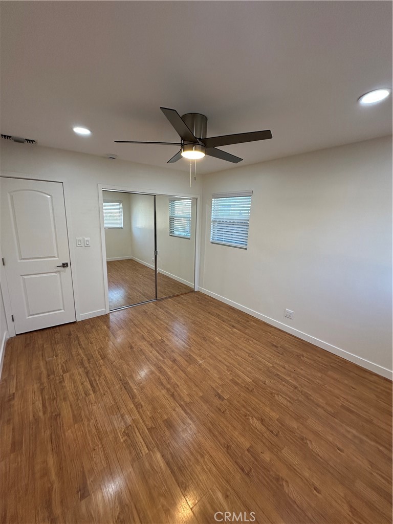 19140 Strathern Street Reseda, CA 91335 - Photo 9 of 33 a view of empty room with wooden floor