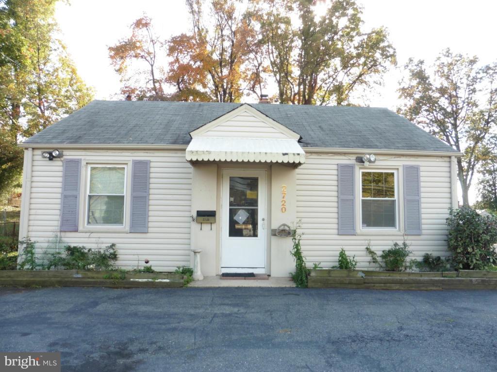 2720 Randolph Road Silver Spring, MD 20902 - Photo 1 of 16 a front view of a house with garden