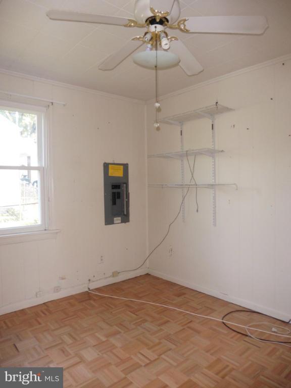 2720 Randolph Road Silver Spring, MD 20902 - Photo 13 of 16 an empty room with a window and a ceiling fan
