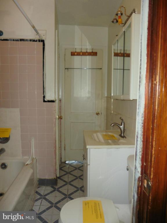 2720 Randolph Road Silver Spring, MD 20902 - Photo 15 of 16 a bathroom with a sink toilet and shower