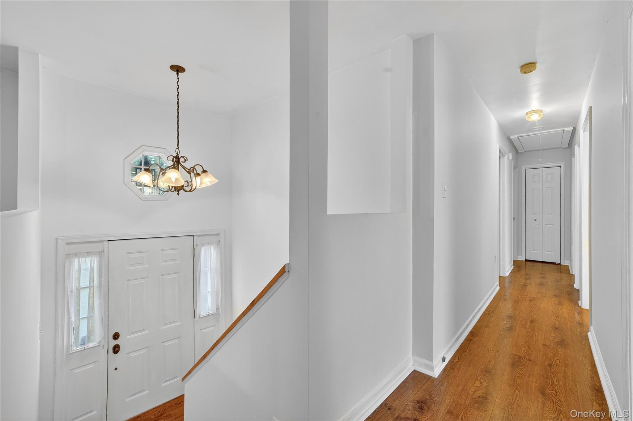 7 Richard Road Mahopac, NY 10541 - Photo 8 of 29 a hallway with a chandelier