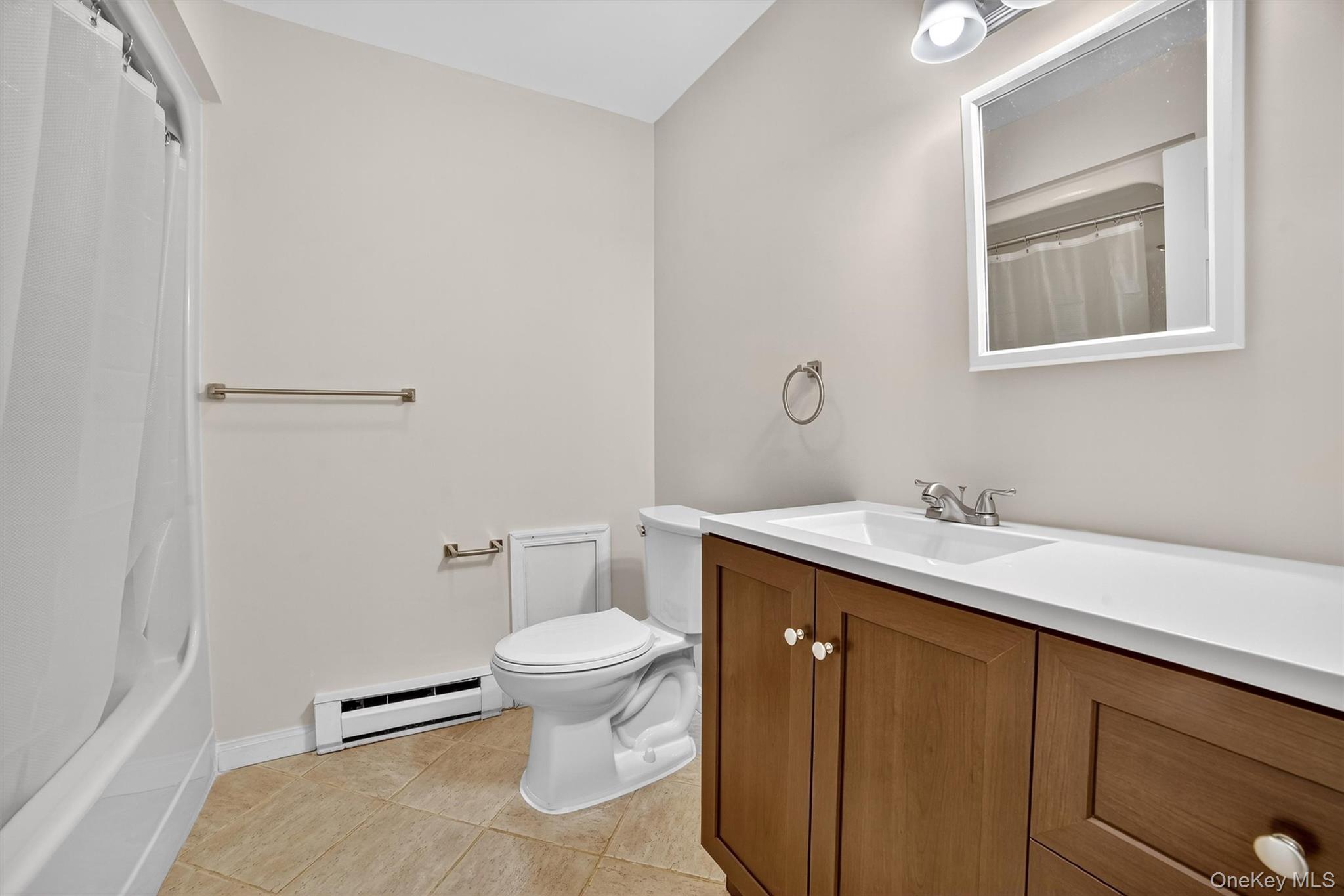 7 Richard Road Mahopac, NY 10541 - Photo 9 of 29 a bathroom with a granite countertop sink toilet and mirror
