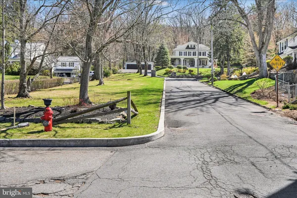 a kitchen with a counter space a sink and stainless steel appliances