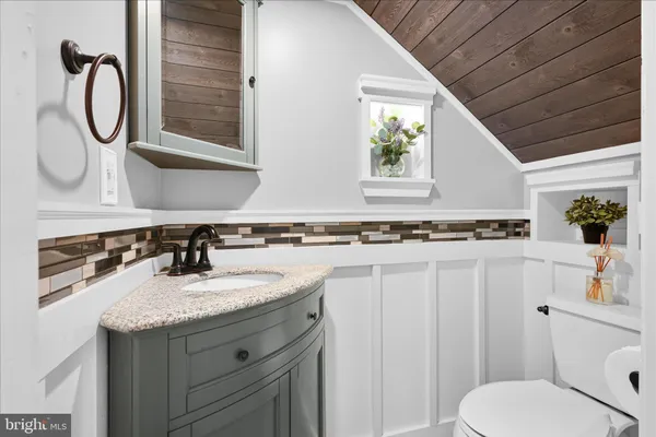 a view of a livingroom with a flat screen tv and gym equipment