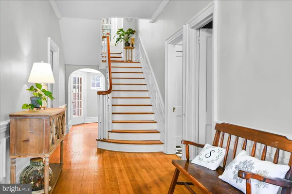 a bathroom with a sink a toilet and a large mirror
