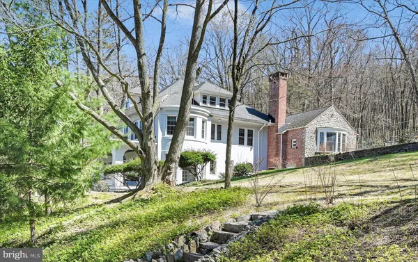 a view of entryway with a door and wooden floor
