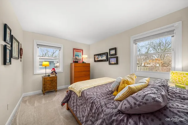 a bedroom with bed and window