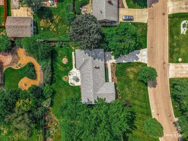 an aerial view of a house with yard swimming pool and outdoor seating