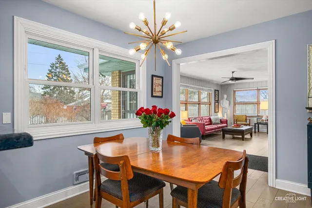 a dining room with furniture and window