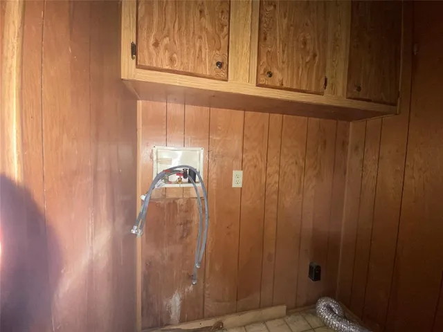 a view of empty room with floor to ceiling window