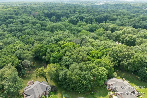 $399,000 | 7670 Wood Violet Court Southeast, Ada, MI 49301