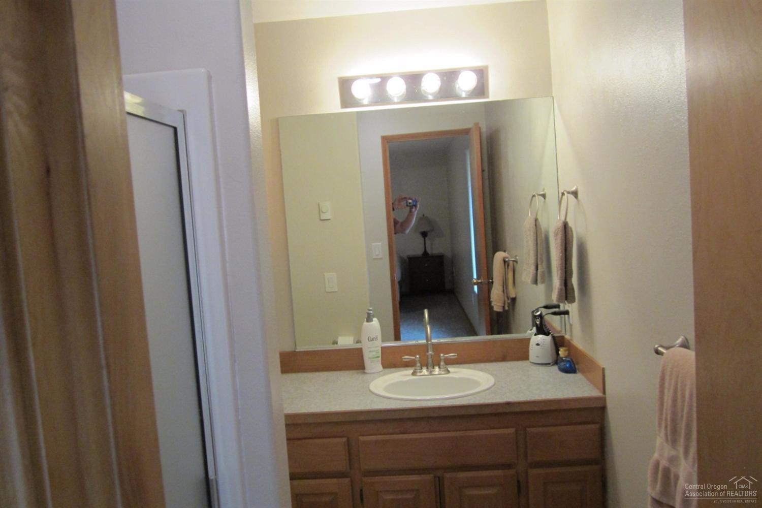 17533 Rosland Road La Pine, OR 97739 - Photo 22 of 25 a bathroom with a sink and a mirror