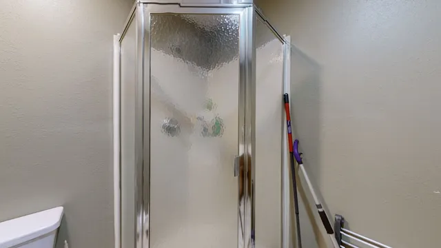 a bathroom with a glass shower door