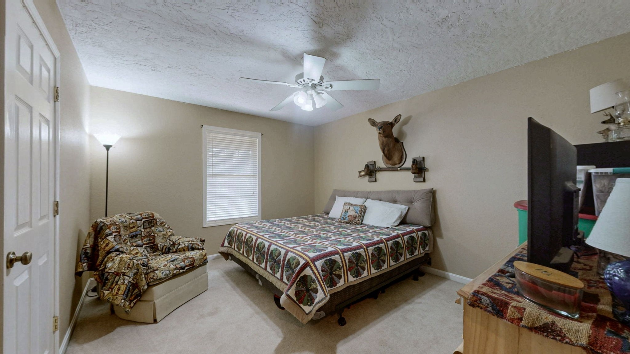 1748 Buffalo Road New Concord, KY 42076 - Photo 17 of 41 a bedroom with a bed and a flat tv screen on dresser