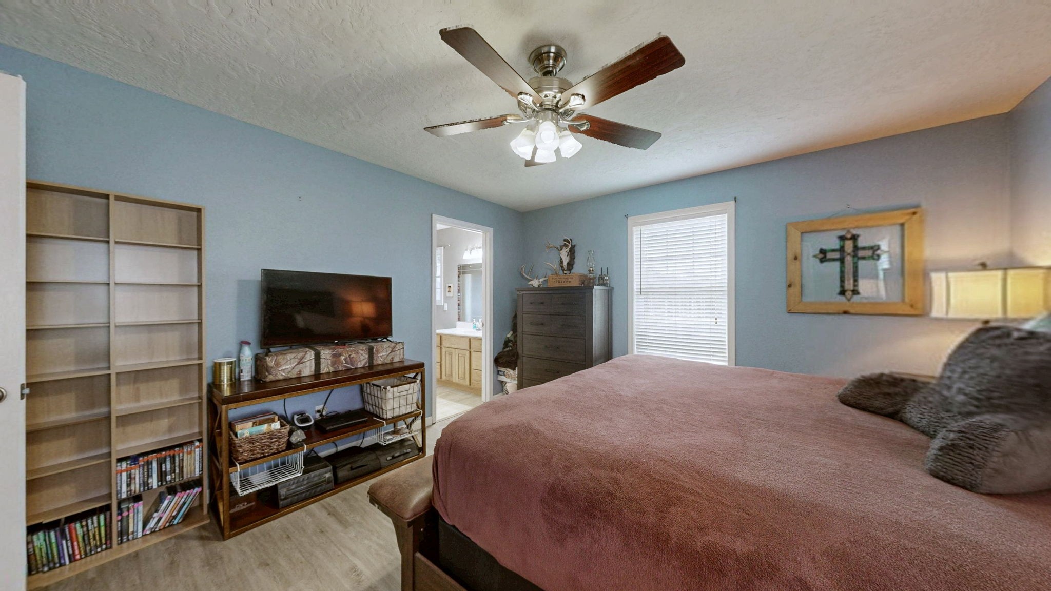 1748 Buffalo Road New Concord, KY 42076 - Photo 22 of 41 a bedroom with a bed and a flat screen tv