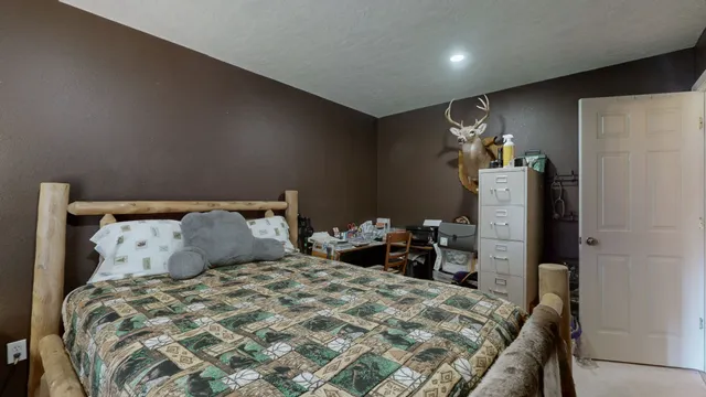 a bedroom with a bed and a table in it