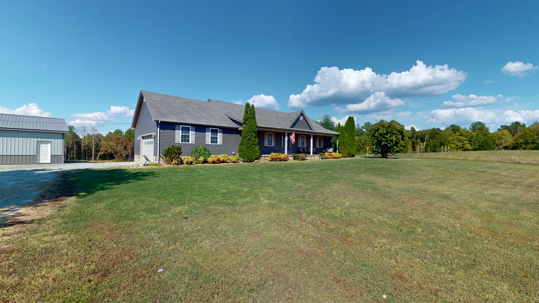 1748 Buffalo Road New Concord, KY 42076 - Photo 26 of 41 a front view of a house with garden
