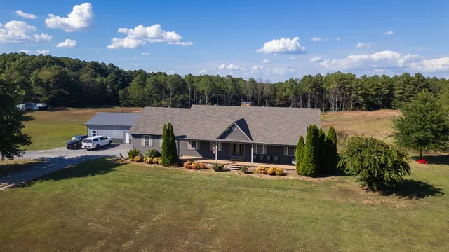 a view of an house with outdoor space and sitting area
