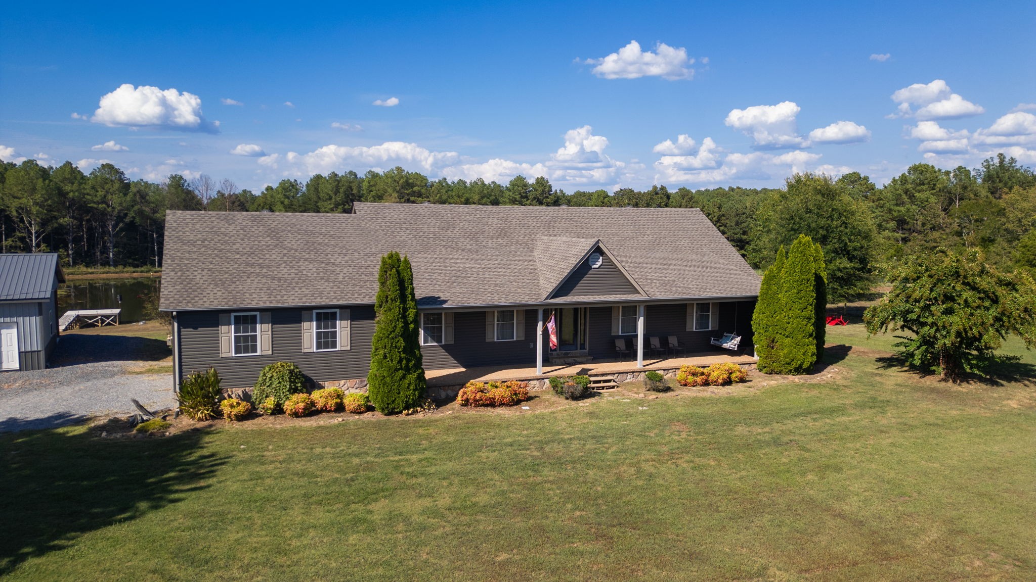1748 Buffalo Road New Concord, KY 42076 - Photo 40 of 41 a front view of a house with yard and patio