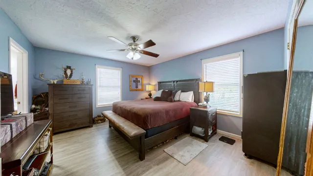 a bedroom with a bed and a closet