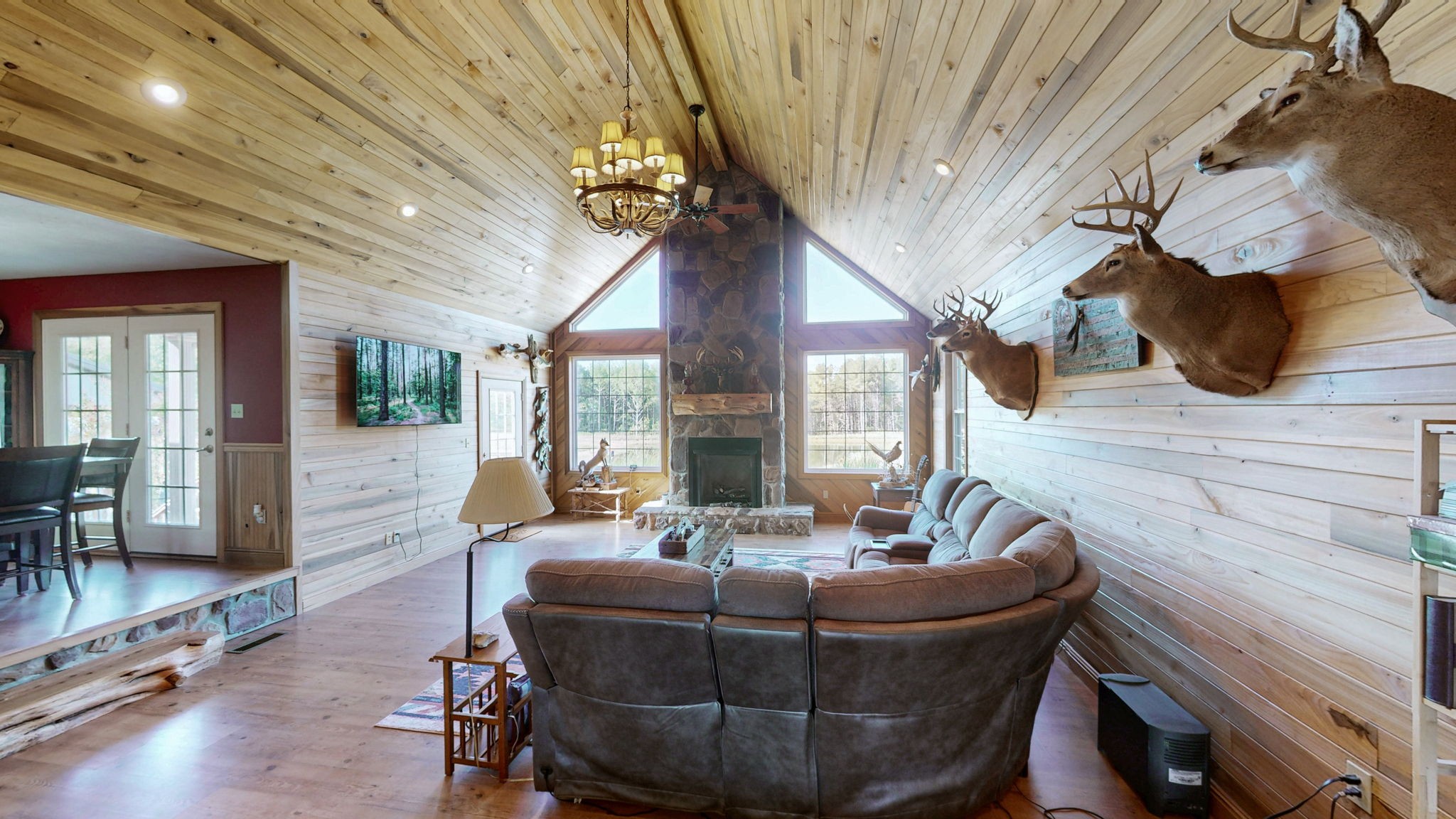1748 Buffalo Road New Concord, KY 42076 - Photo 6 of 41 a living room with couches and a fireplace with wooden floor