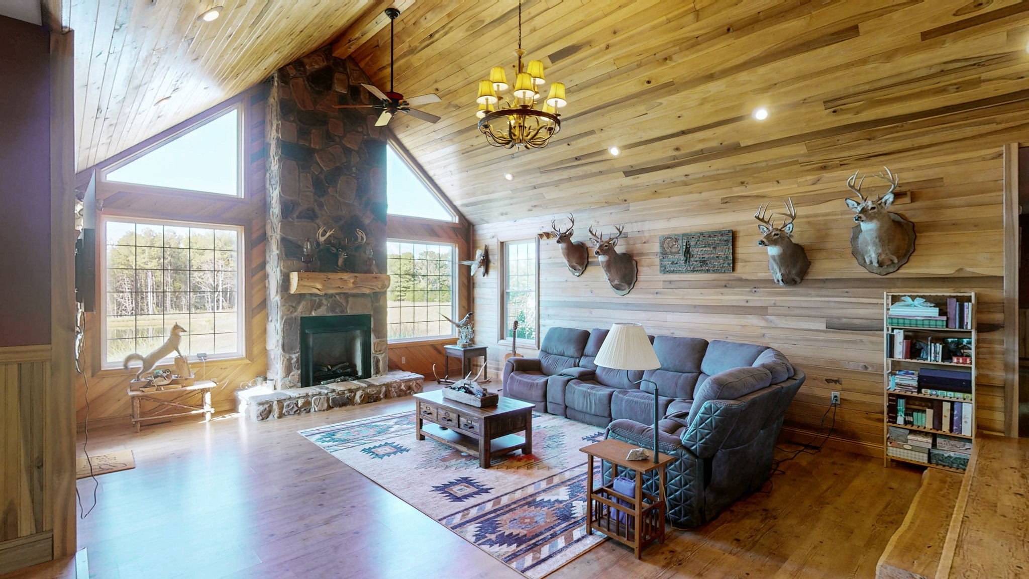 1748 Buffalo Road New Concord, KY 42076 - Photo 7 of 41 a living room with fireplace furniture and a wooden floor