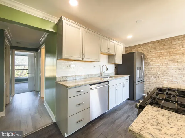 a kitchen with a sink stove and refrigerator