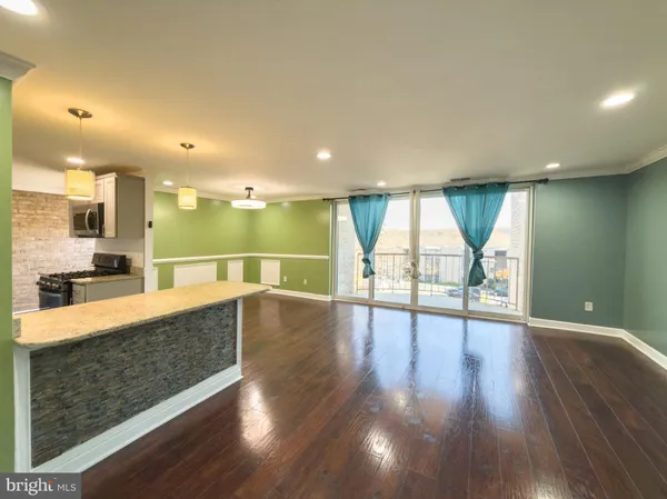 a view of a kitchen with a table and chairs